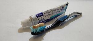 Blue and white toothbrush and Enzymatic dog toothpaste